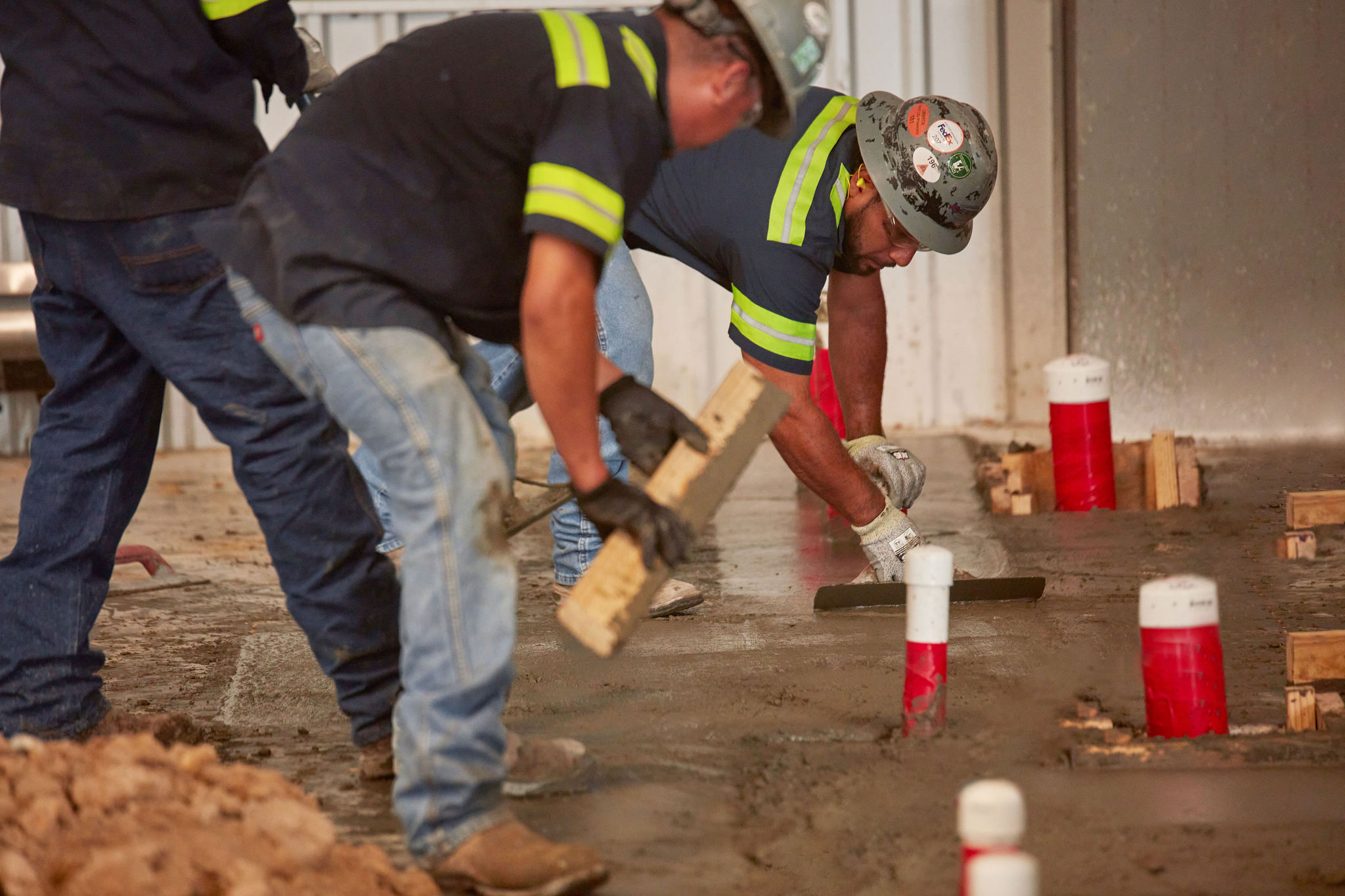 Pouring concrete is a work of art. It requires team work and dedication to ensure the concrete pour finishes smooth.
